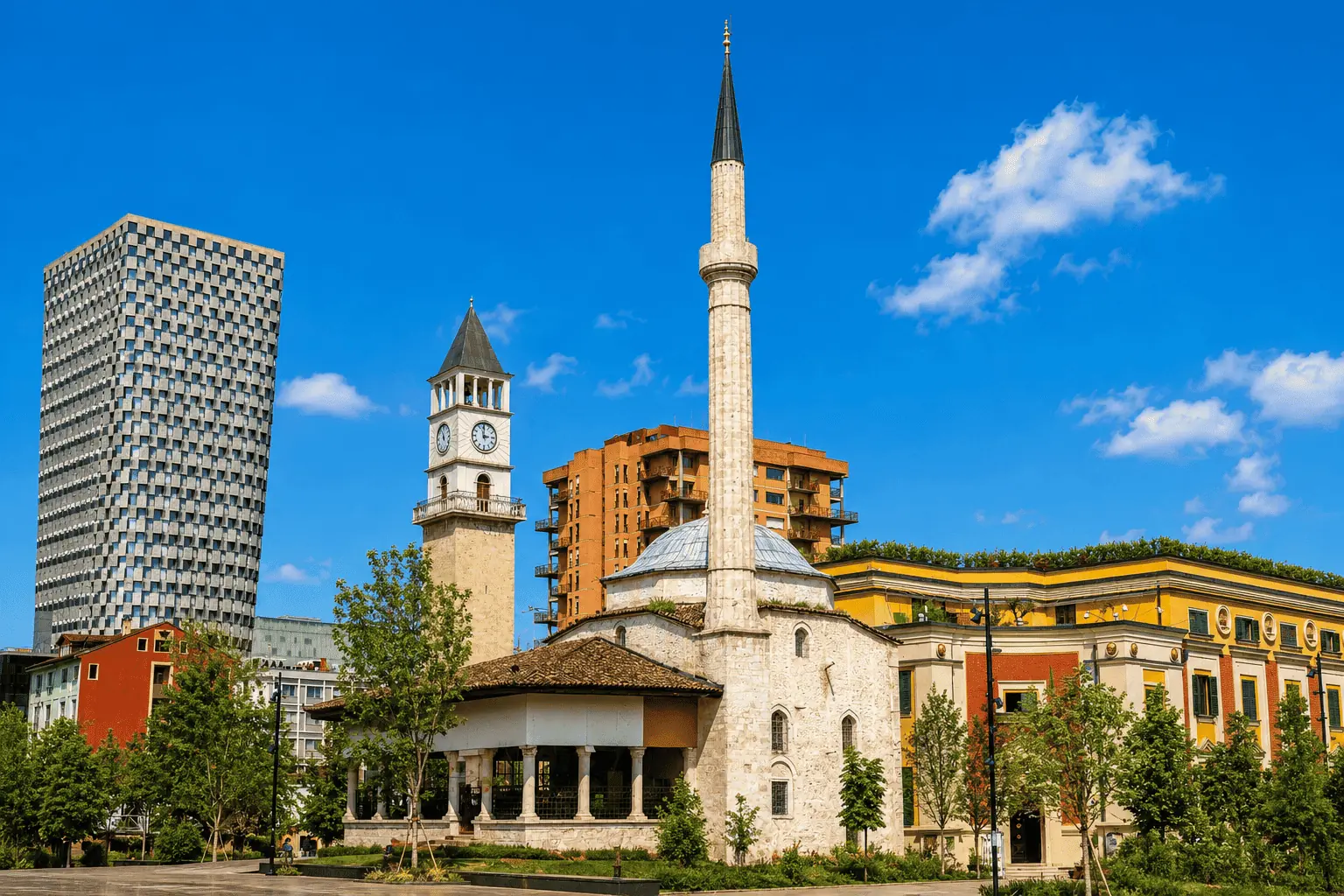 Et'hem Bej Mosque and its minaret in Skanderbeg Square, Tirana, with the historic Clock Tower and modern buildings in the background